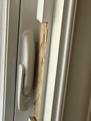 Installer hacksawed around the window latch AFTER installing the framing.