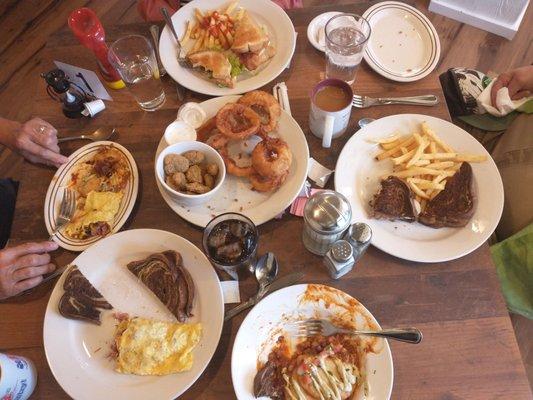 Meat omelette, perogies,patty melt ,onion rings, deep fried mushrooms , and a cinnamon filled role.