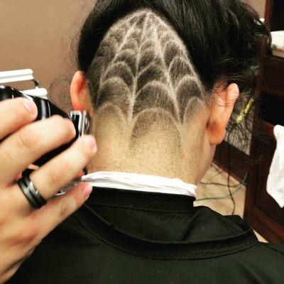 Faded undercut spiderweb design.