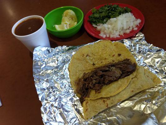 Birria de Chivo. Delicious soft tortillas scratch made by hand per order. Hot savory consomé comes with tacos for dipping and sipping.