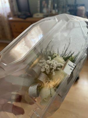 Beautiful wrist corsage, secured in a box and tissue for safe handling. It made it to the prom intact.