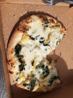 My friend's personal size spinach artichoke alfredo pizza. 7" personal pizzas are available at lunch.