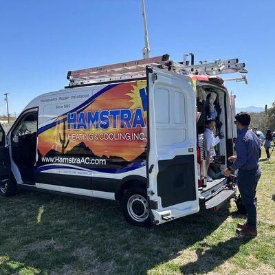 Our team at a school career day showing off our van and explaining what it is like to be an HVAC technician