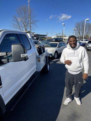 David in front of one of the trucks in his fleet