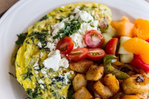 Greek Omelet with breakfast potatoes and fruit