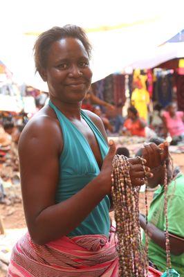 Emily (artisan) from Banda, Uganda. Paper Bead Jewelry.