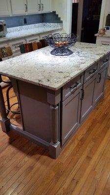 New kitchen cabinets with custom island and granite counter tops