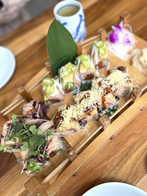 albacore roll (L), kaizen roll (top), salmon aburi roll (top)