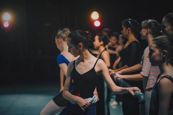 IBA Dancers training on stage.