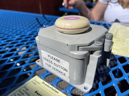 Outdoor dining - push button for service.