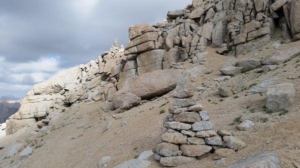 Follow these 3, 6 foot cairns up and over the boulders towards the summit