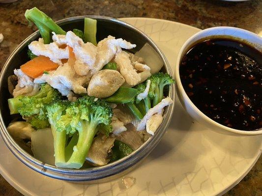 Steamed chicken and veg, garlic sauce on the side.