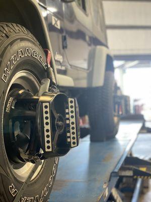 A Wheel Alignment in process. Sensors are attached to the wheels to determine alignment accuracy.