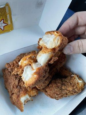 Chicken strips I received with something orange inside.