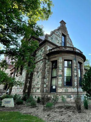 The beautiful historic 1880's stone structure in a Richardsonian Romanesque Architectural Style is a Castle/City Hall @ Hunnewell Park.