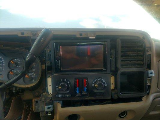 A deck, four speakers, door lock actuators, and power windows all installed on 2005 Chevrolet Silverado