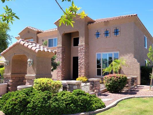 Energy-efficient windows replacements on stucco home.