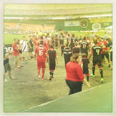 DC United and Chicago Fire coming out of tunnel for the match.  My two boys are on the right escorting two United players.