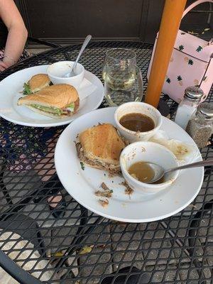 Chicken caprese on the left, a pork dip on the right - empty soup and wine glasses because it's all so good!