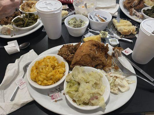 Fried chicken mac and cheese along with cabbage