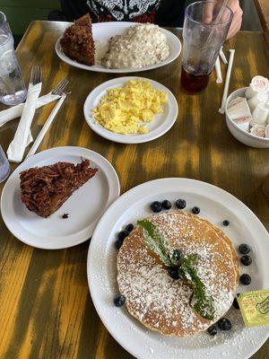 Short stack blueberry pancakes. Latka x2. Side of eggs. And sausage biscuits and gravy