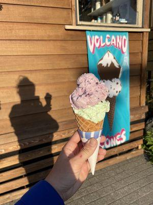 Double scoop in a waffle cone - Huckleberry and Mint Chip