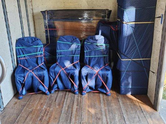 Kitchen chairs prepped and ready to be stacked.