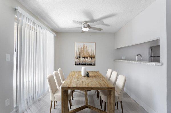 Dining Room With Dining Table And Chairs Large Balcony Window