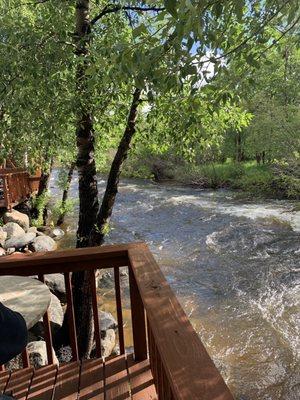 Cabin balcony overlooking river.