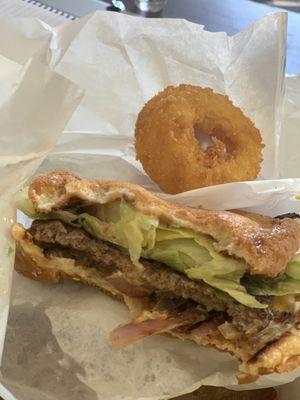 Bacon cheeseburger with onion rings, and a cookies and cream milkshake