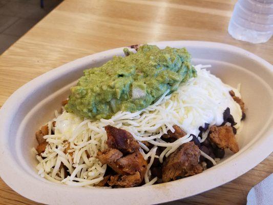 Chicken, brown rice, black beans, sour cream, guacamole and shredded cheese