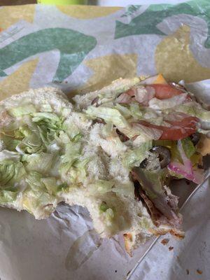 This is extra lettuce and tomato I wonder what the normal amount is none !!! Sad used to love subway.