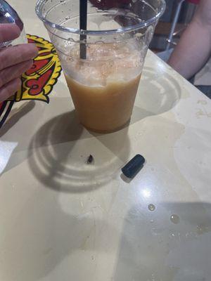 A bug and this black thing came out of my drink.