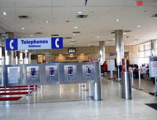 Pay phones opposite ticket counter.  Don't see those much any more!