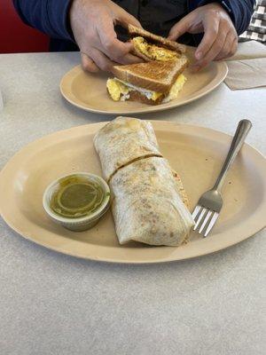 Burrito with chorizo and breakfast sandwich.