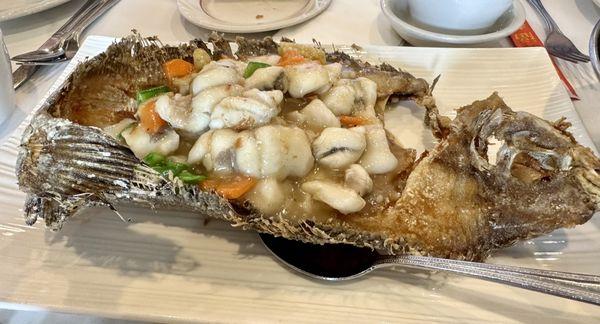 Whole deboned flounder served on crispy fish