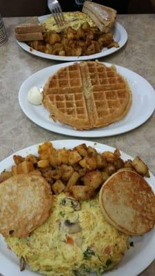 Veggie cheese omelet, potatoes, buttered english muffin and Walnut waffles!