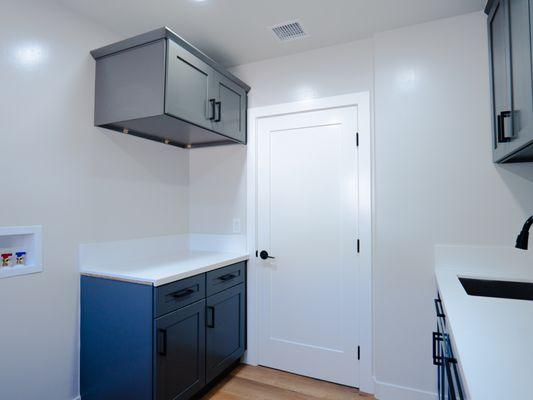 LAUNDRY ROOM, FOLDING AREA, EXTRA CABINETS FOR STORAGE