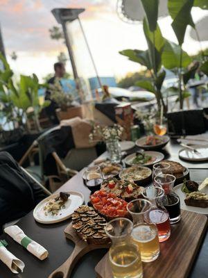 Wine flight, ricotta fig, tomato tahini, tuna conserva toast, crispy potatoes, quinoa salad, beef meatballs