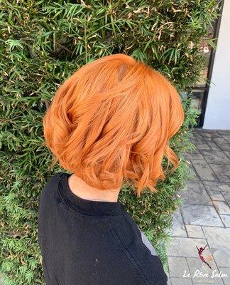 Full-Color Orange Hair with a short haircut and blow-dry. Give us a call to book your next appointment (818) 923-5005