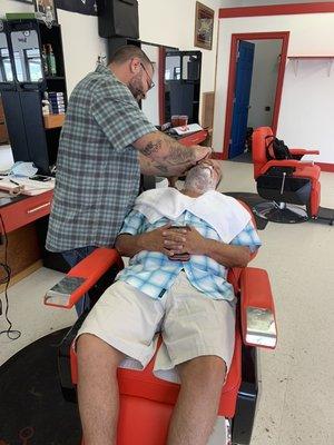 Hot towel shave in progress