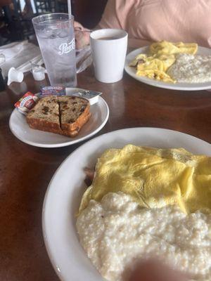 Triple Crown Omelette, grits, raisin toast, coffee and water