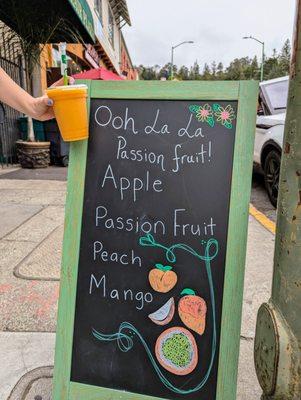 Ooh La La Passion Fruit smoothie. Contains apple, passionfruit, peach, and mango. Cold, refreshing, and delicious. $9.78 after tax and tip.