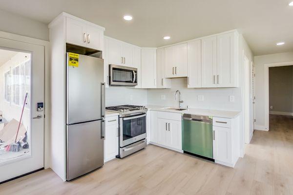 Even in compact spaces, style knows no bounds. Feast your eyes on the charm of this small kitchen, a jewel within our 8-unit project in SF.