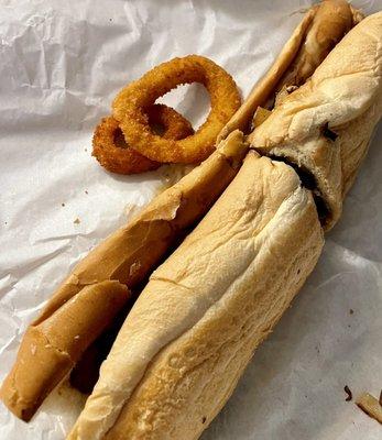 Mushroom cheese steak sandwich and a sampling of the crispy onion rings.