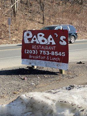 The restaurant is set back from the road, and thus easy to miss...so watch out for this sign at the entrance to the parking lot.