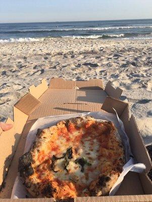 Margherita pizza by the beach