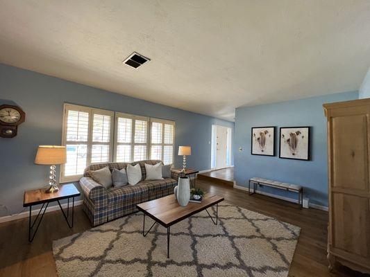 Living room.  They combined the personal furniture of the owner with their staging articles