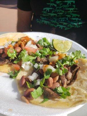 Carne asada tacos with homemade hot sauce - $2 each! Smoking deal, smoking hot, hot sauce!