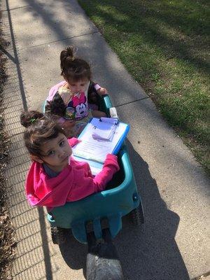 My daughters helping hand out fliers